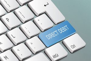 What is direct debit and how can it help businesses grow and achieve consistent cash flow?